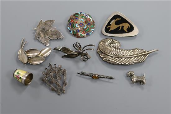Two Danish sterling silver brooches, a cased enamelled thimble and seven other assorted silver brooches.